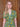 Blonde model wearing sage green 1940s floral shirtwaist dress with collar and green buttons