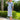 Model wearing gingham skirt suit.