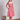 Woman in red and white vertical stripe 1950s sleeveless dress with white collar and heels