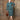 Redhead woman posing in 1940s Lovett green buttoned jacket and pencil skirt suit