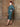 Side view of model wearing the suit.