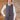 Man wearing grey houndstooth Clubman waistcoat with white collared shirt and green tie