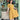 Woman in 1950s Mustard & Cream Soutache Decor shirtwaister dress posing by retro diner bar