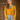 Model wearing 1950s style mustard yellow cardigan buttoned over a vintage plaid dress